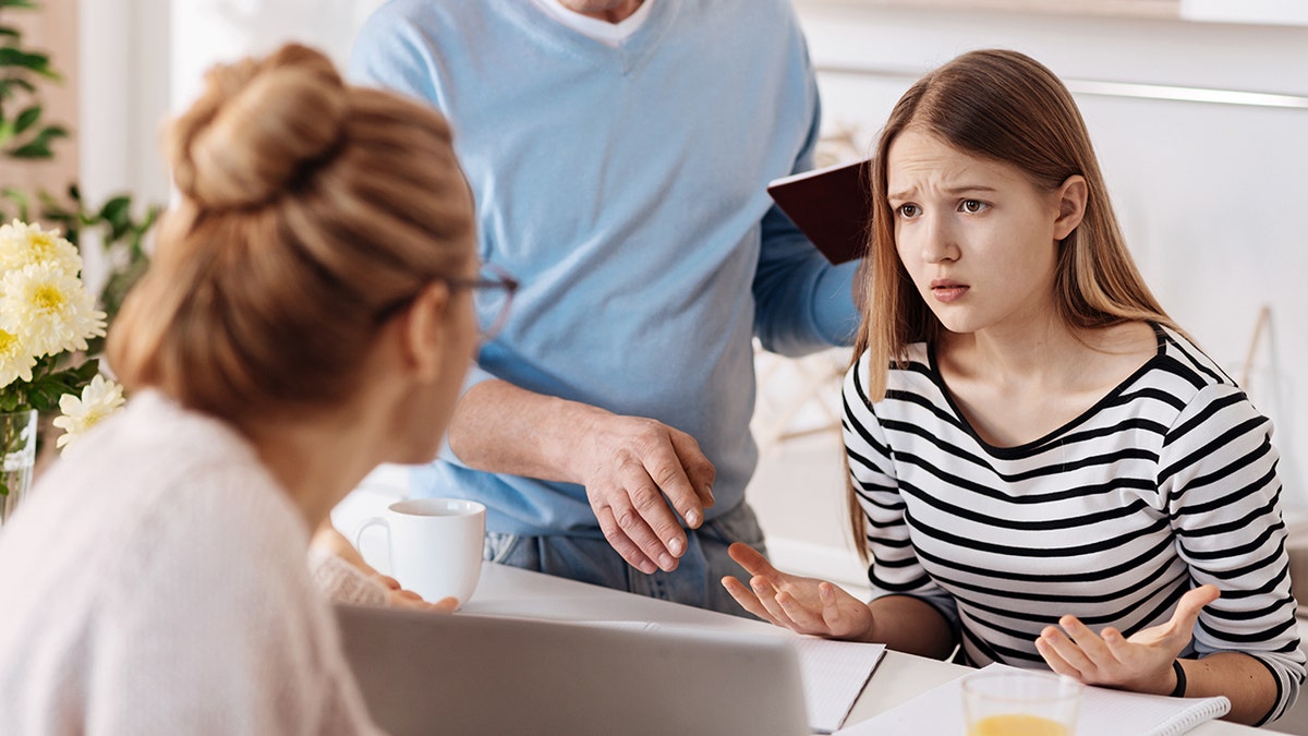 Mom talking to daughter about the cost