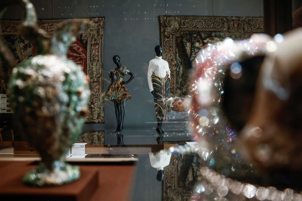 Fashion designs, including dresses from Alexander McQueen's Spring-Summer 2010 Collection (left) on show at the Louvre Museum.