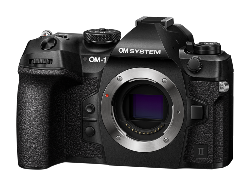 The image shows the body of the OM system camera. It is black with texture and various control buttons. The lens of the lens is revealed, expressing the feeling. The name of the brand appears on the upper left part of the camera.